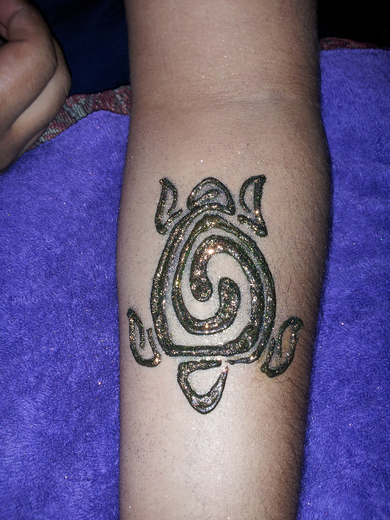 Green glitter turtle on a calf